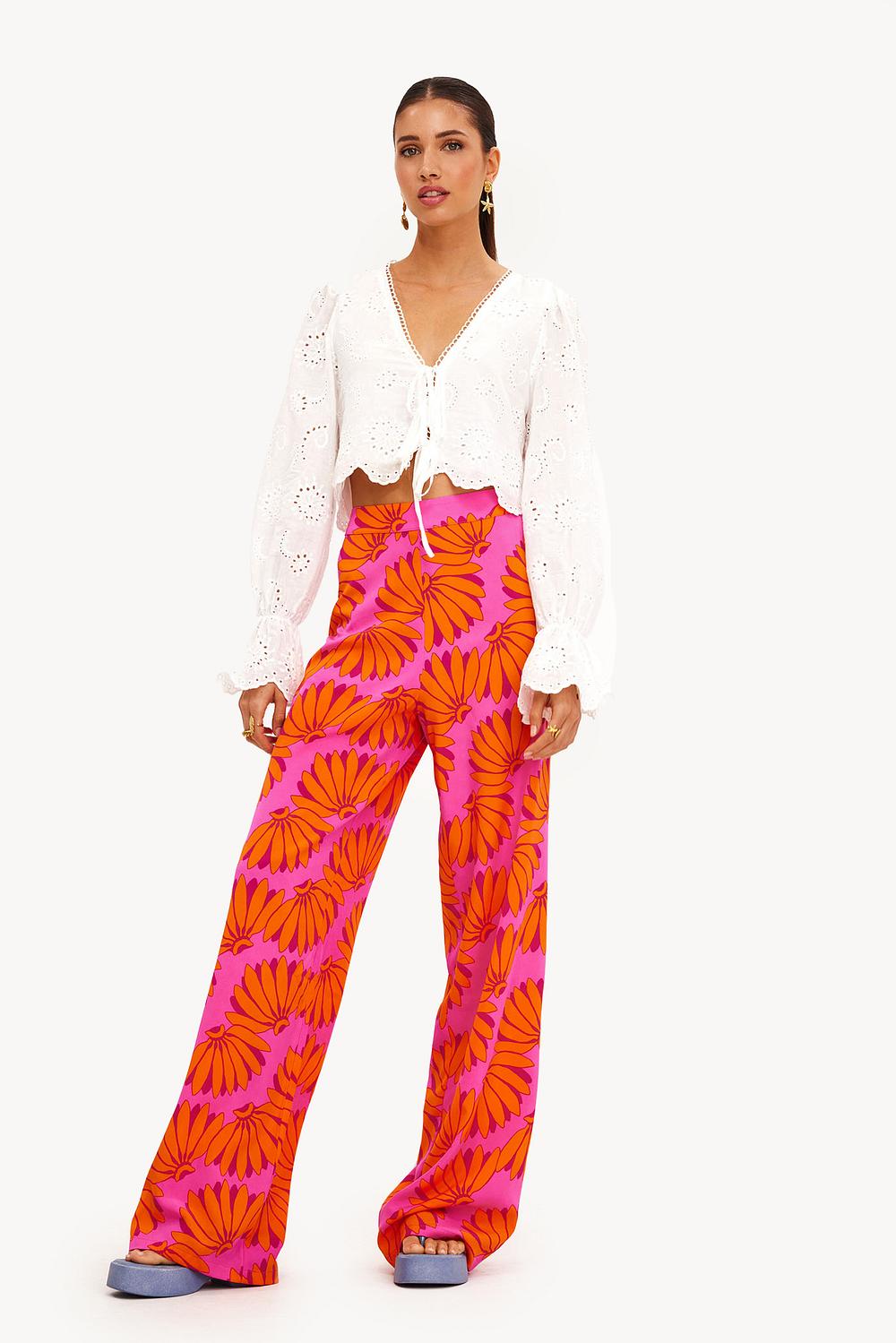 Orange trousers with tropical print
