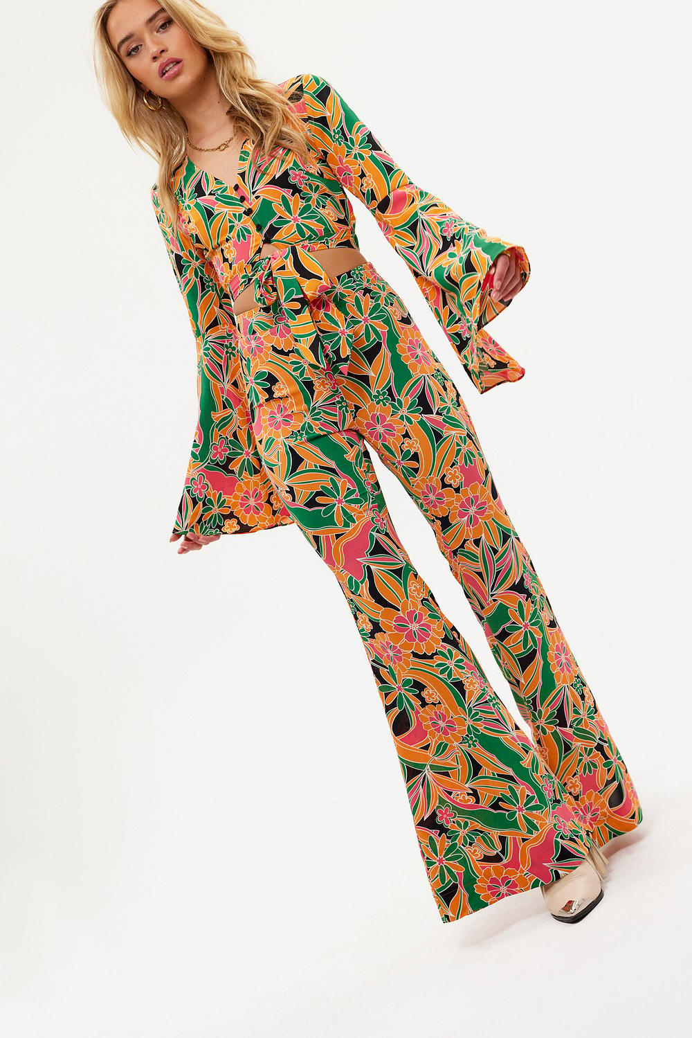 Flared trousers with floral print