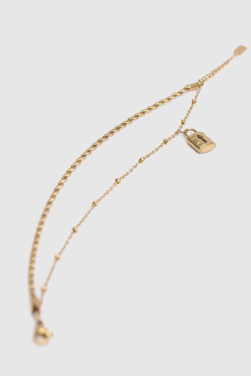 Golden bracelet with lock pendant