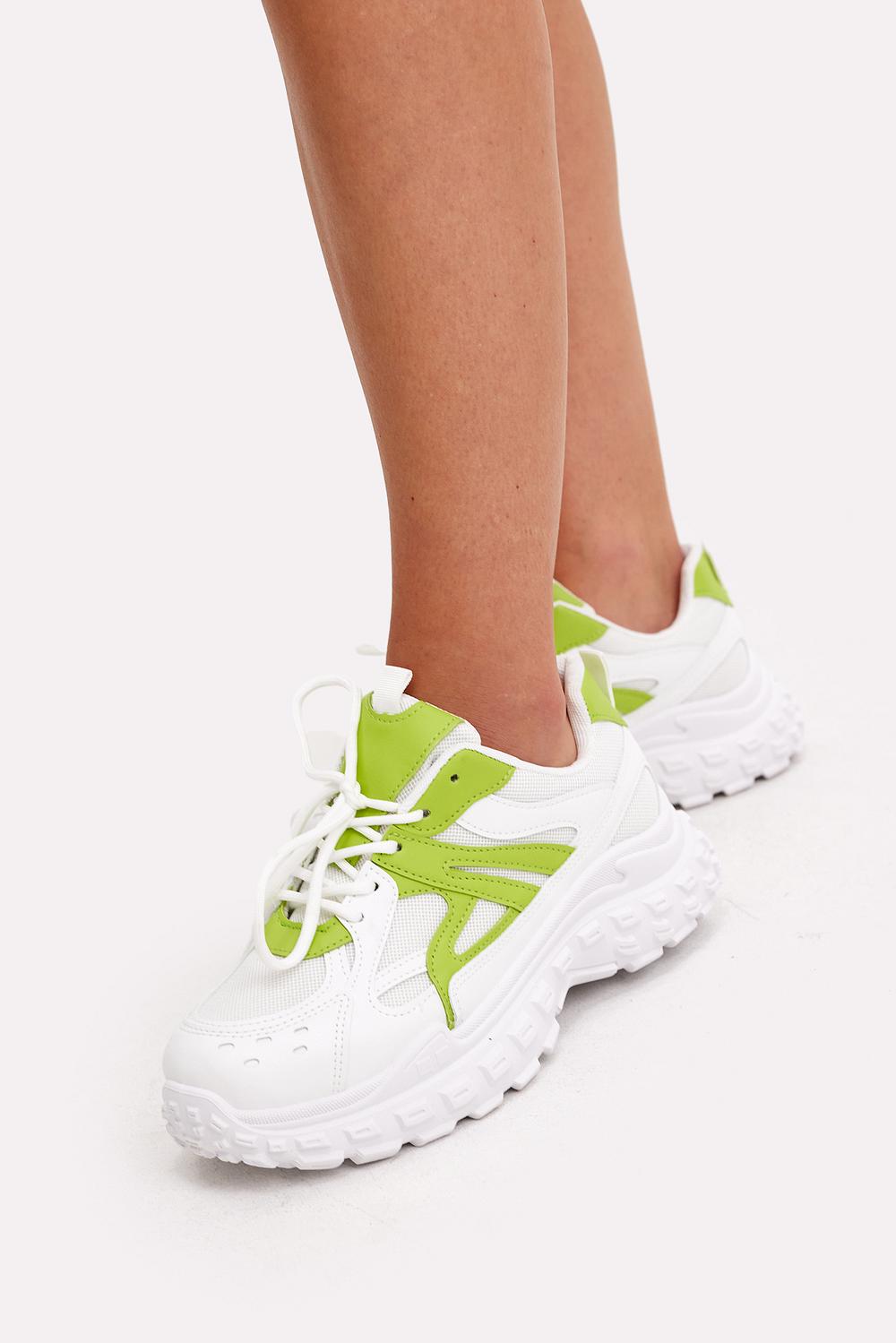 Witte sneakers met groene details