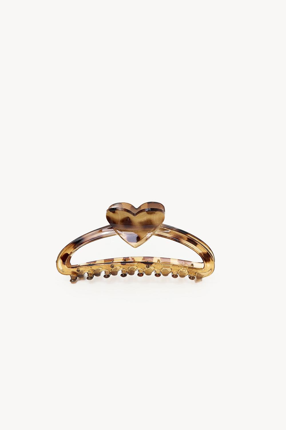 Pinza de pelo marrón con estampado de leopardo