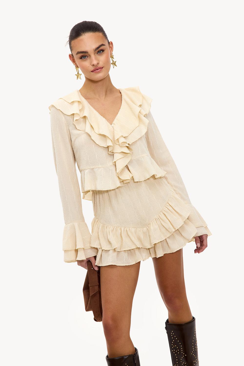 Off-white top with ruffles