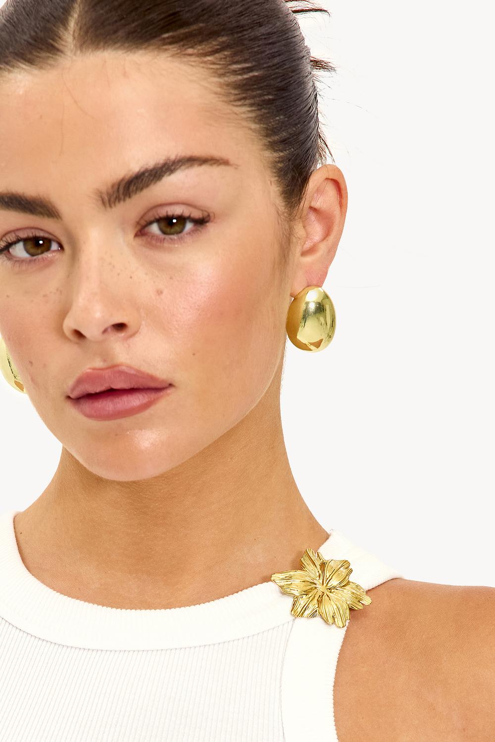 Gouden bloem pin