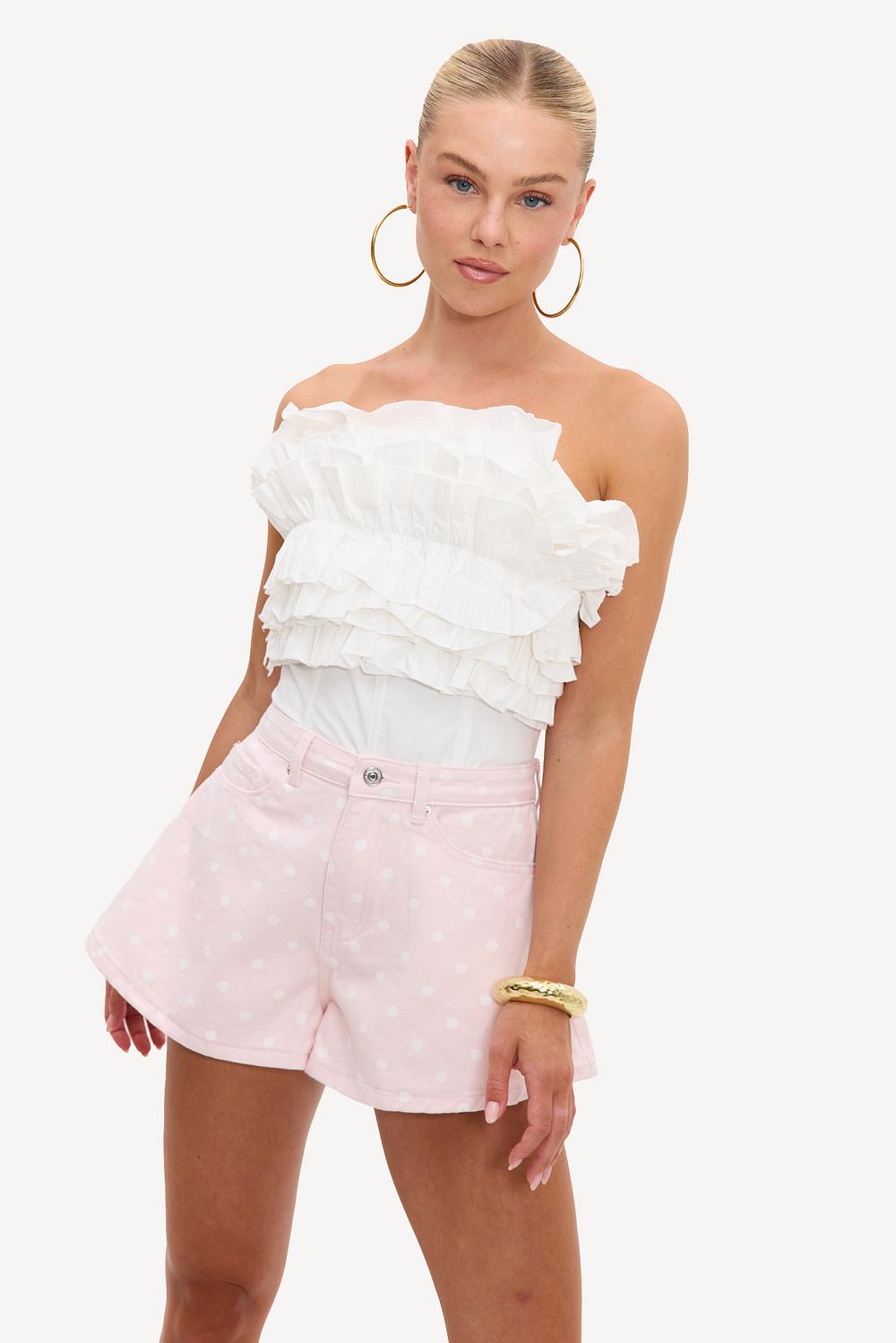 Pantalones cortos vaqueros rosa claro con lunares blancos