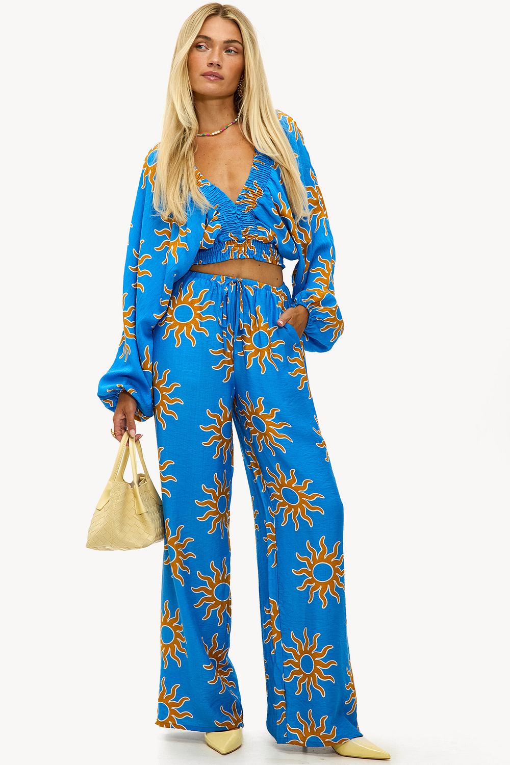 Blauwe broek met zonnen