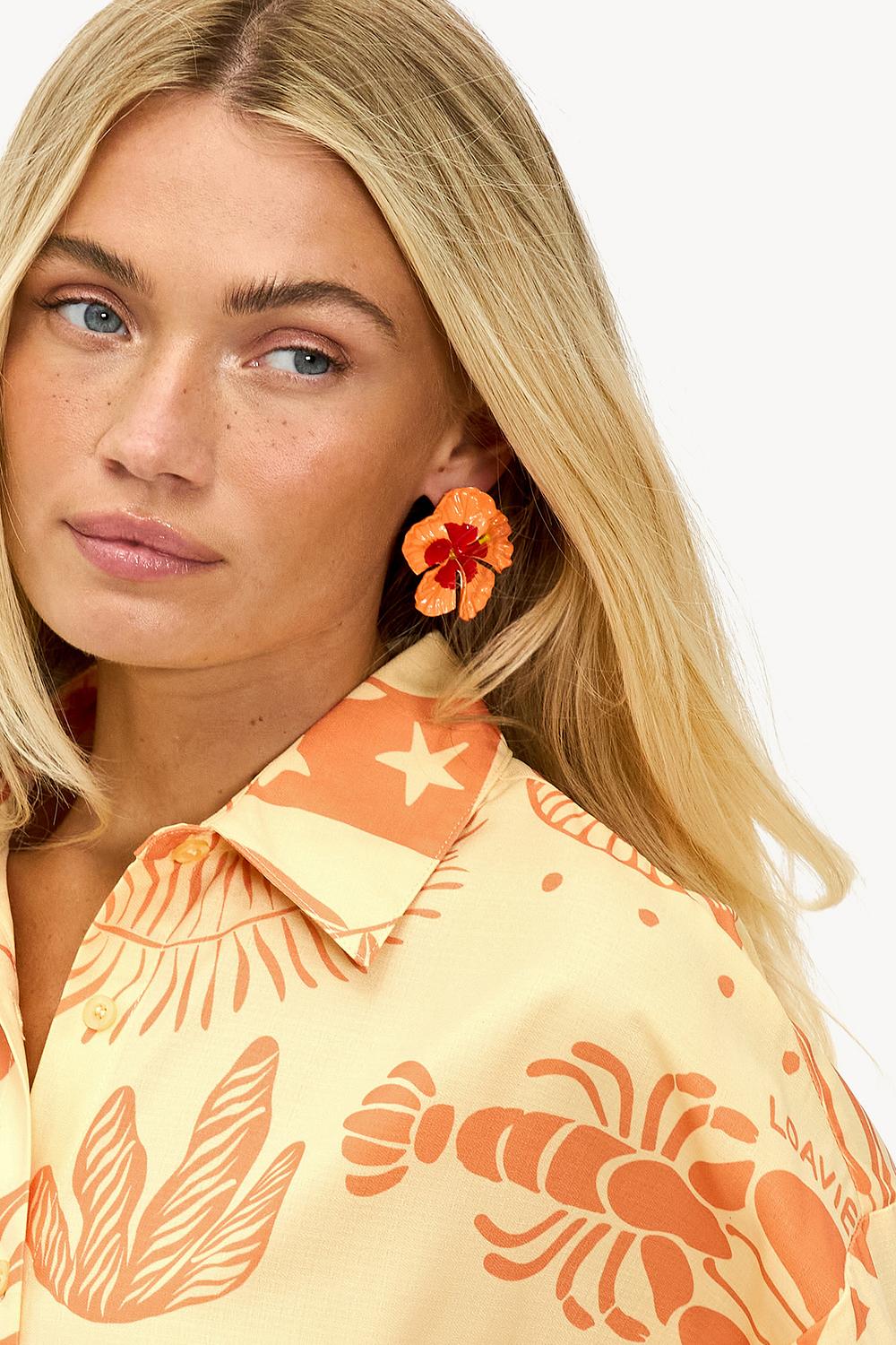 Boucles d'oreilles orange avec fleur