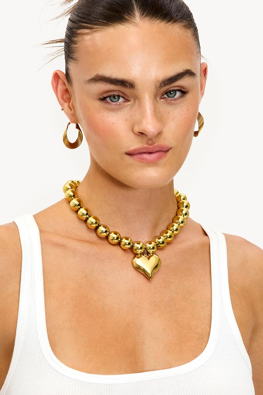 Gold necklace with heart