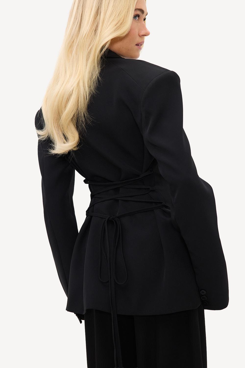 Black blazer with shoulder pads and laces
