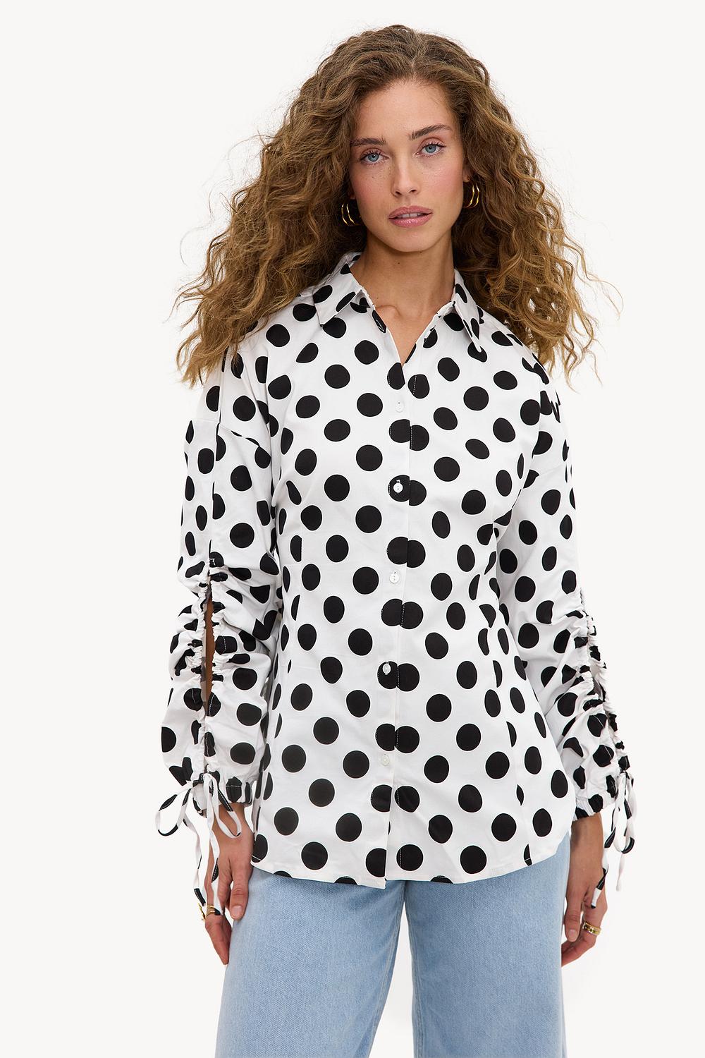 White blouse with dots