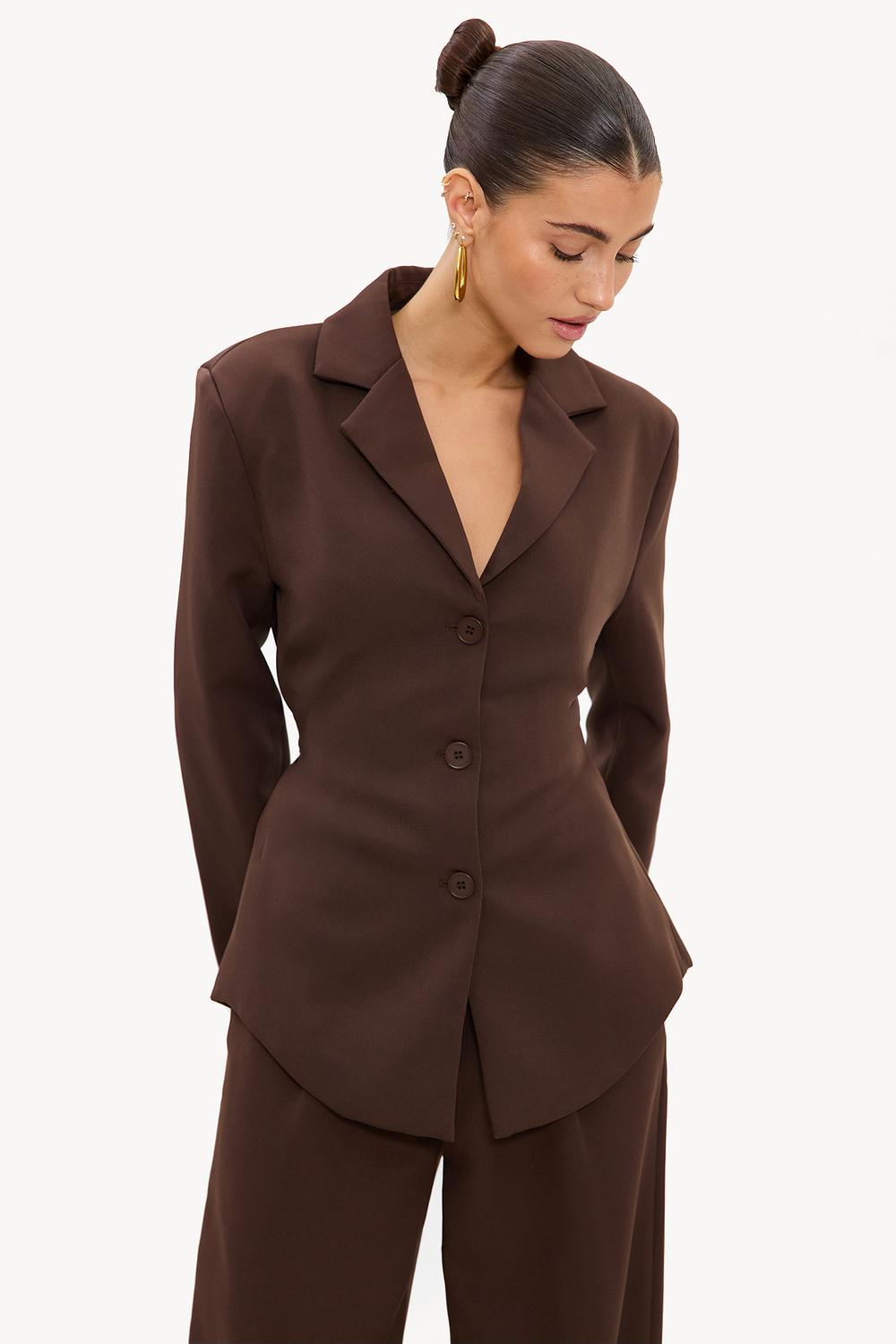 Dark brown blazer with shoulder pads and a tie belt