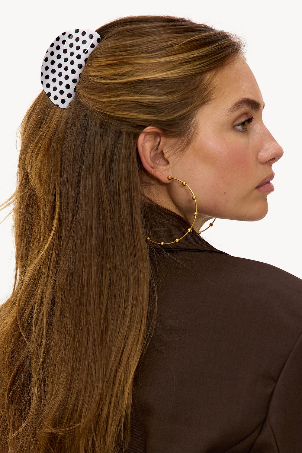 White hair clip with dots