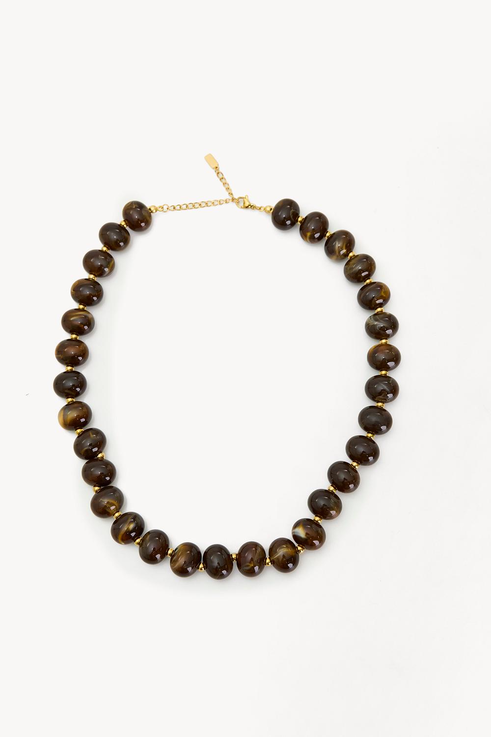 Gouden ketting met bruine kralen