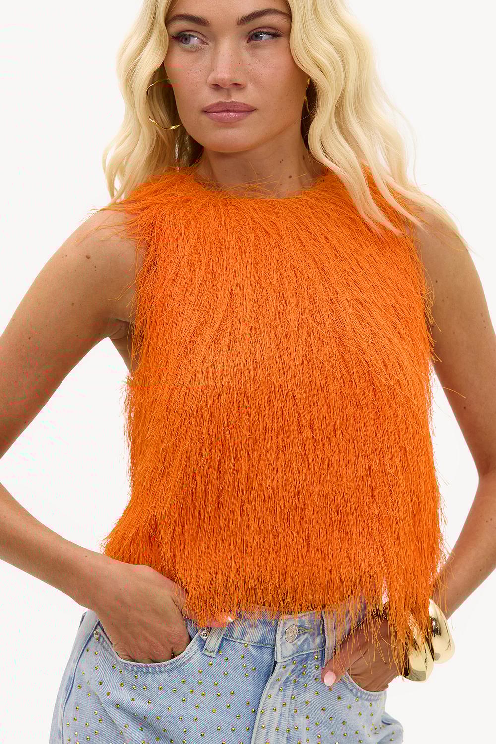 Top naranja con flecos