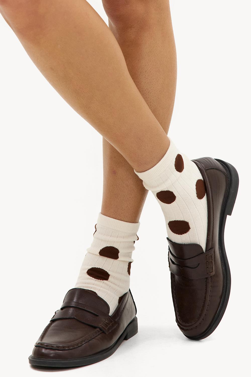 White socks with brown polka dots