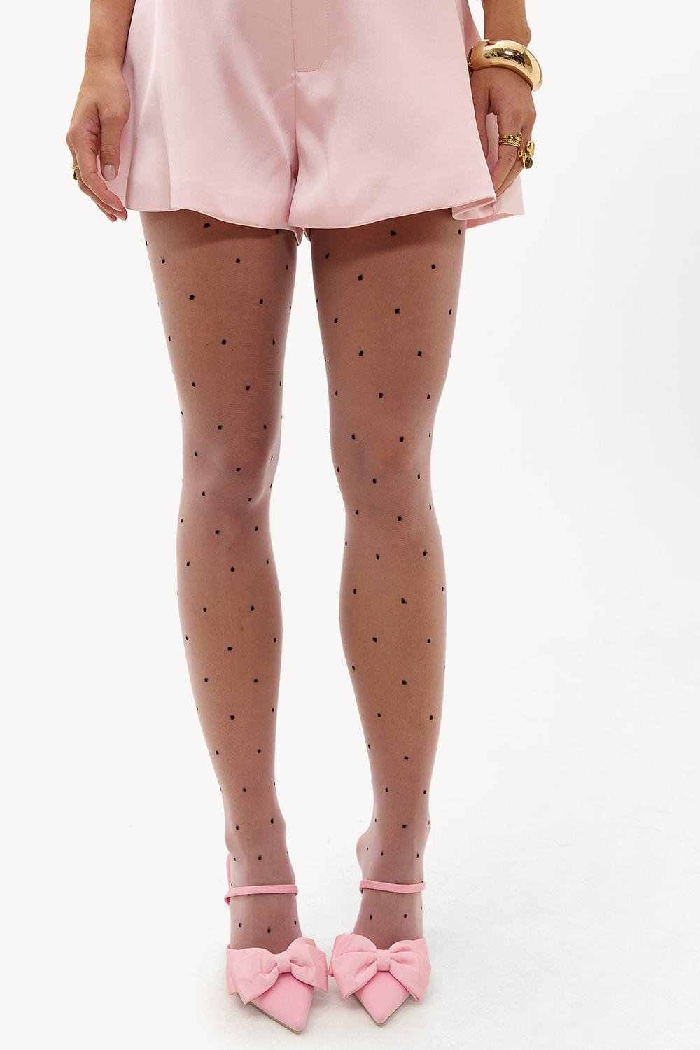 Collants roses à pois