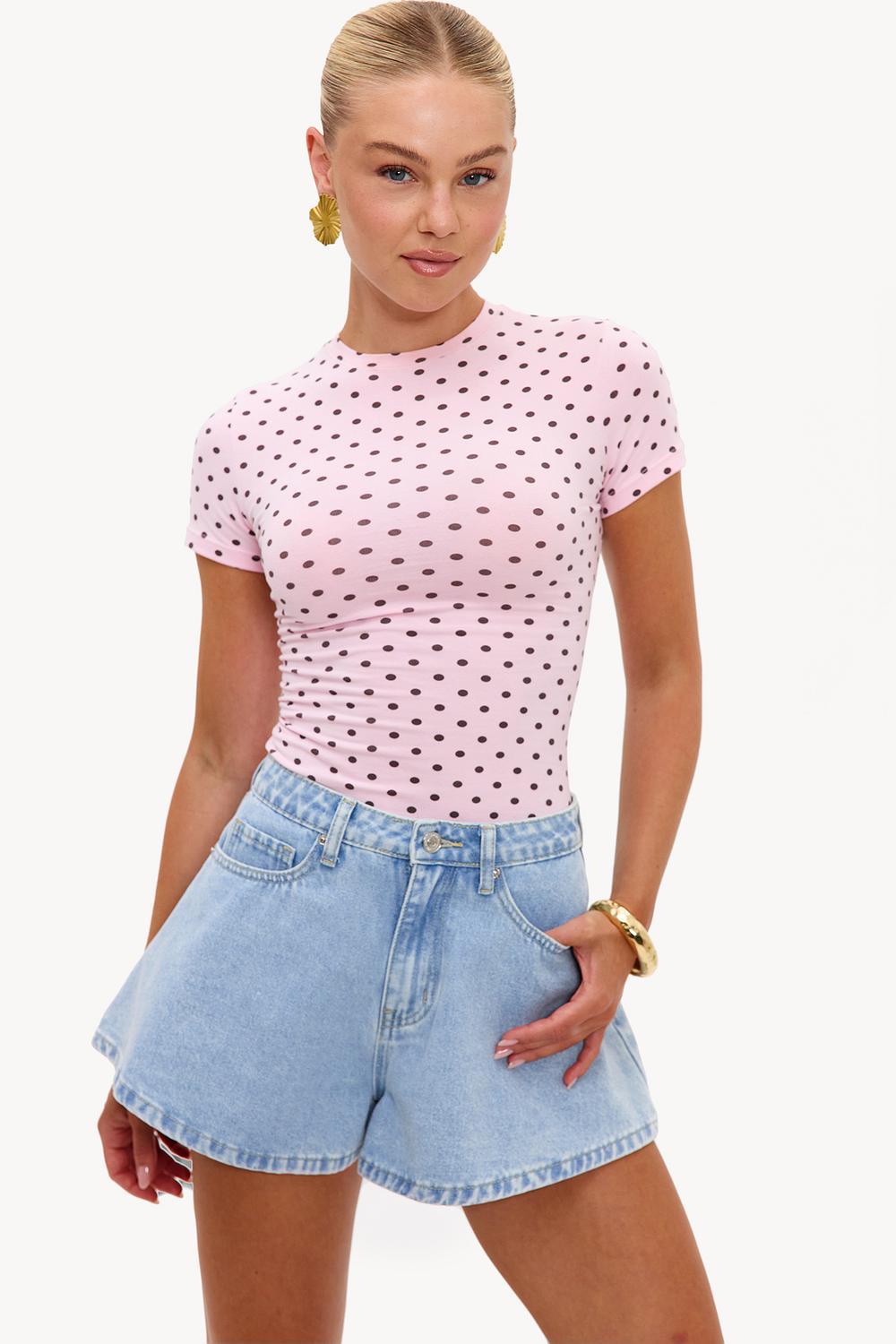 Pink short-sleeved top with brown polka dots