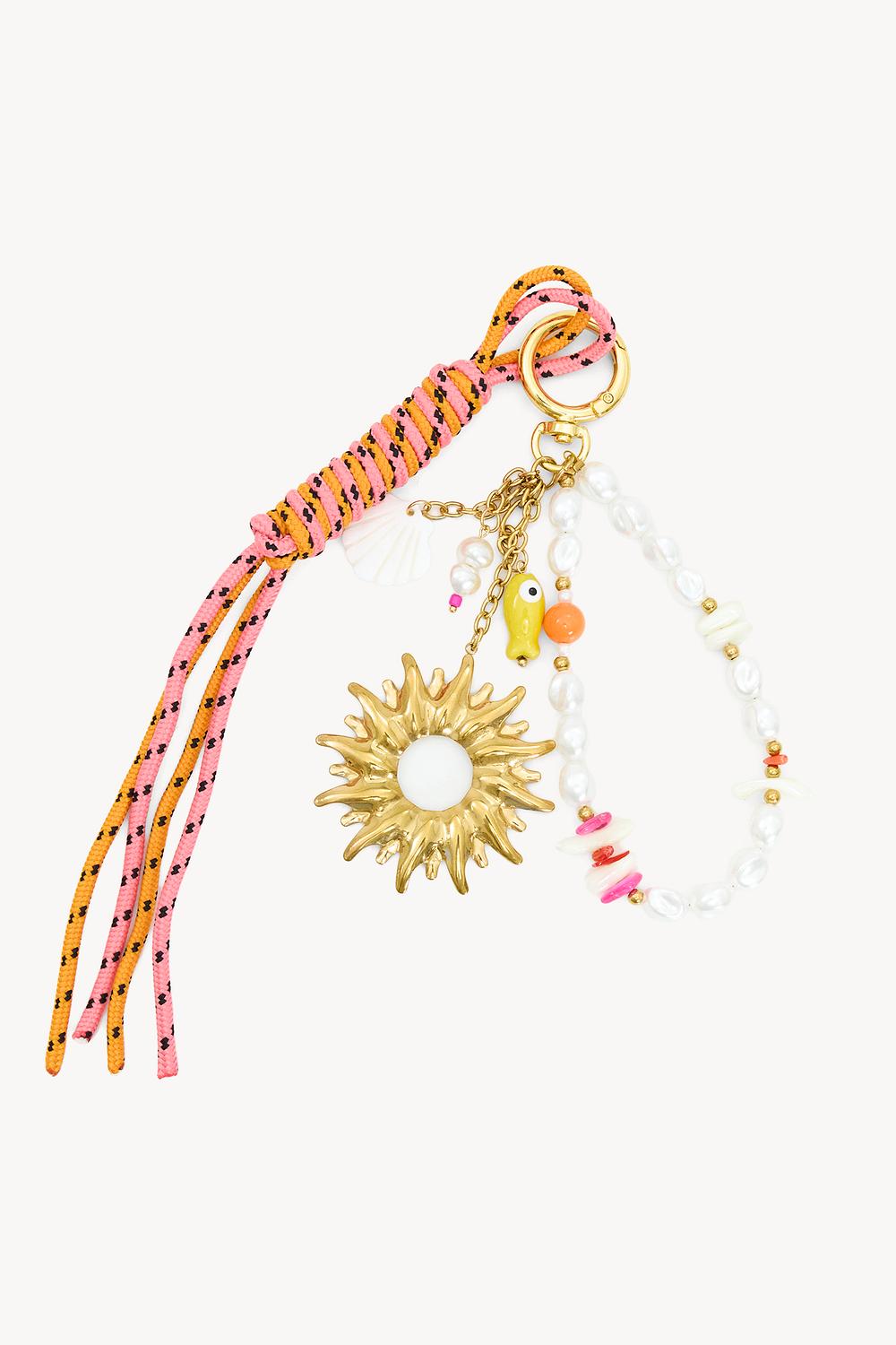 Porte-clés rose avec breloque soleil