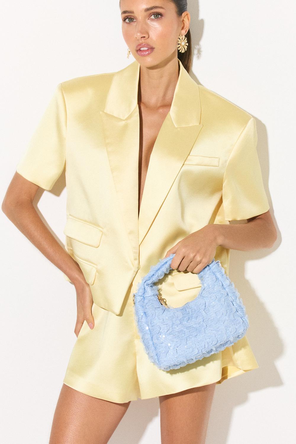 Light blue handbag with mesh and sequins