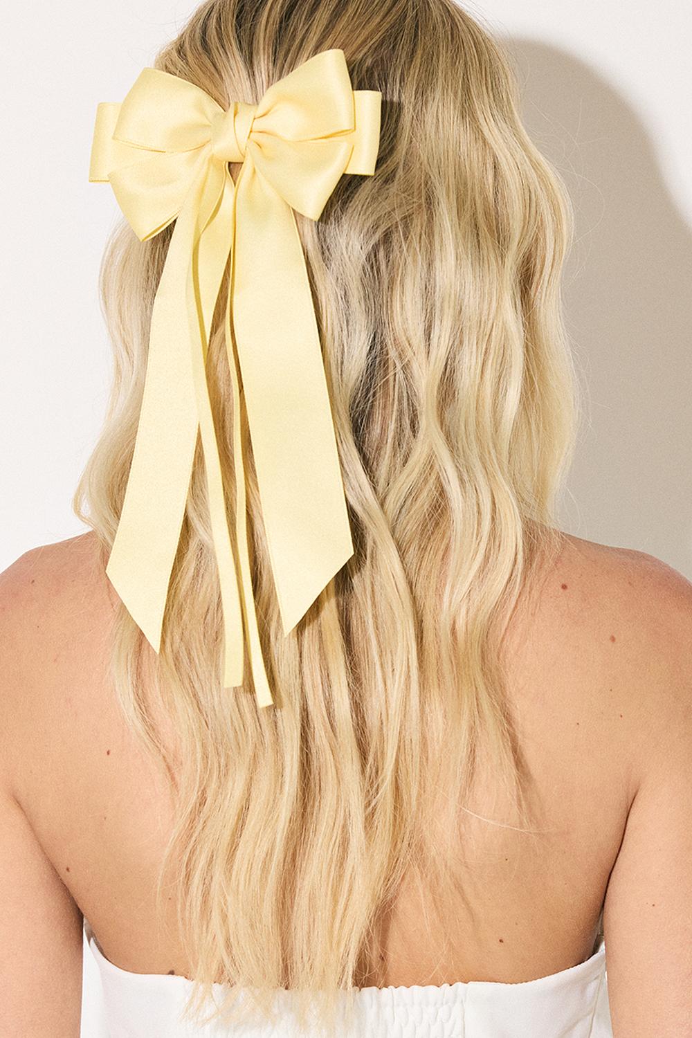 Lichtgele haarclip met strik