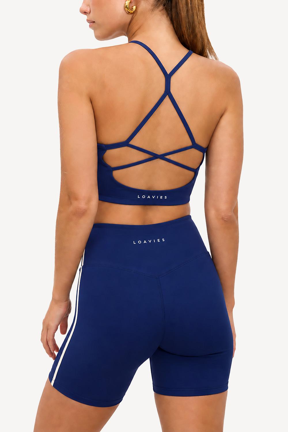 Top deportivo corto azul oscuro con almohadillas y espalda abierta