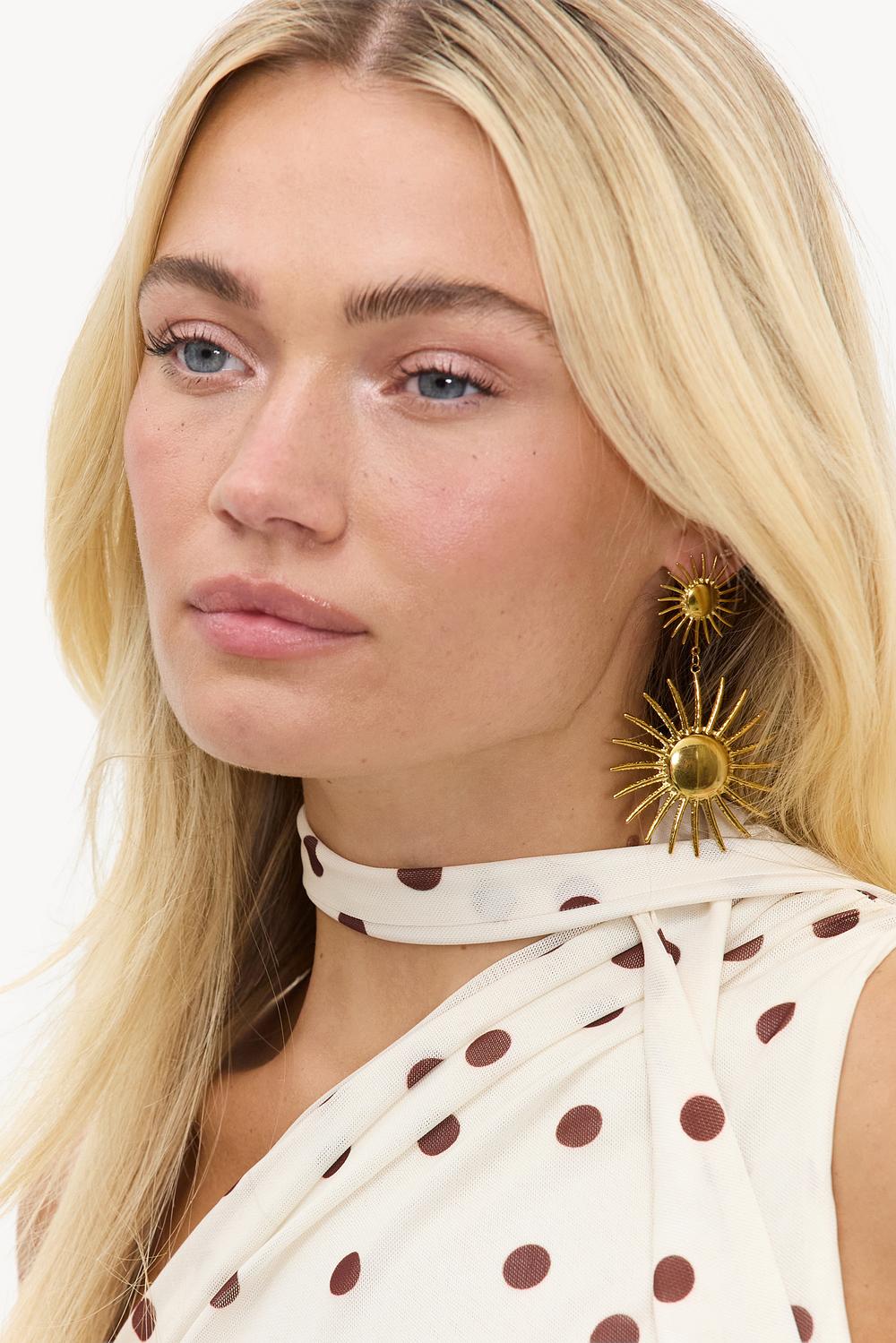 Gold statement earrings with sun
