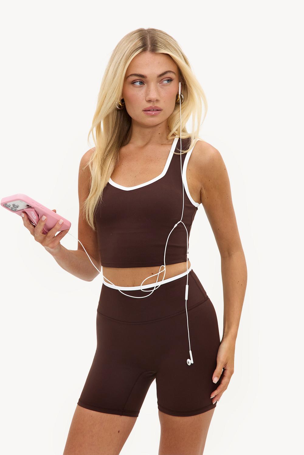 Dark brown sports shorts with white details