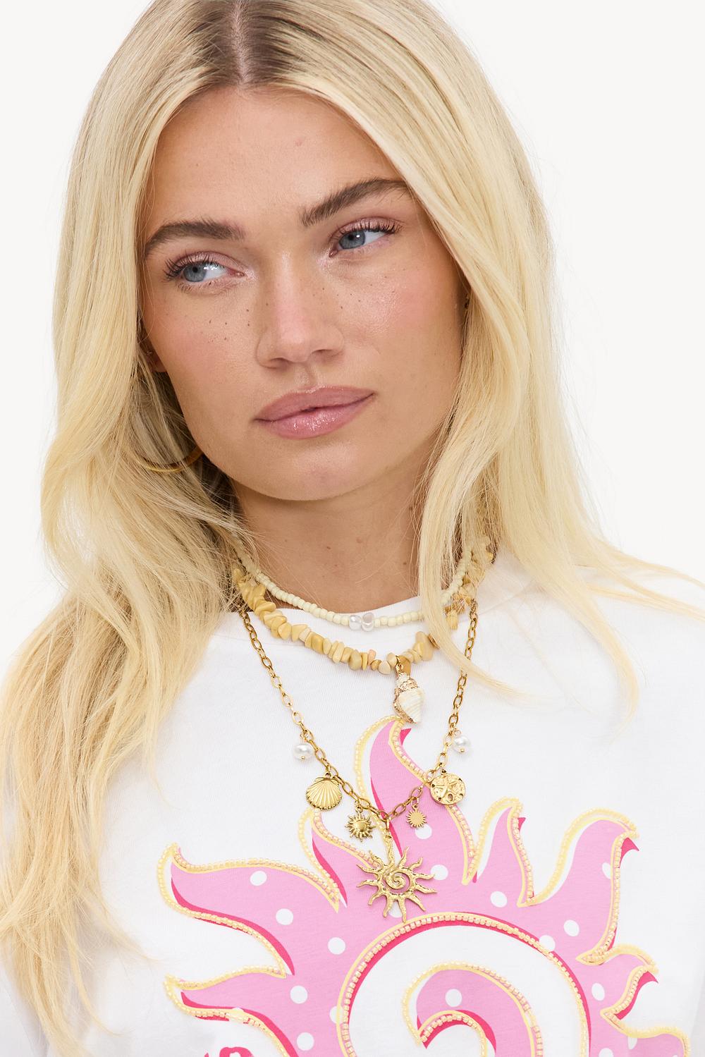 Collar dorado con cuentas amarillas y dijes (pack de 3)