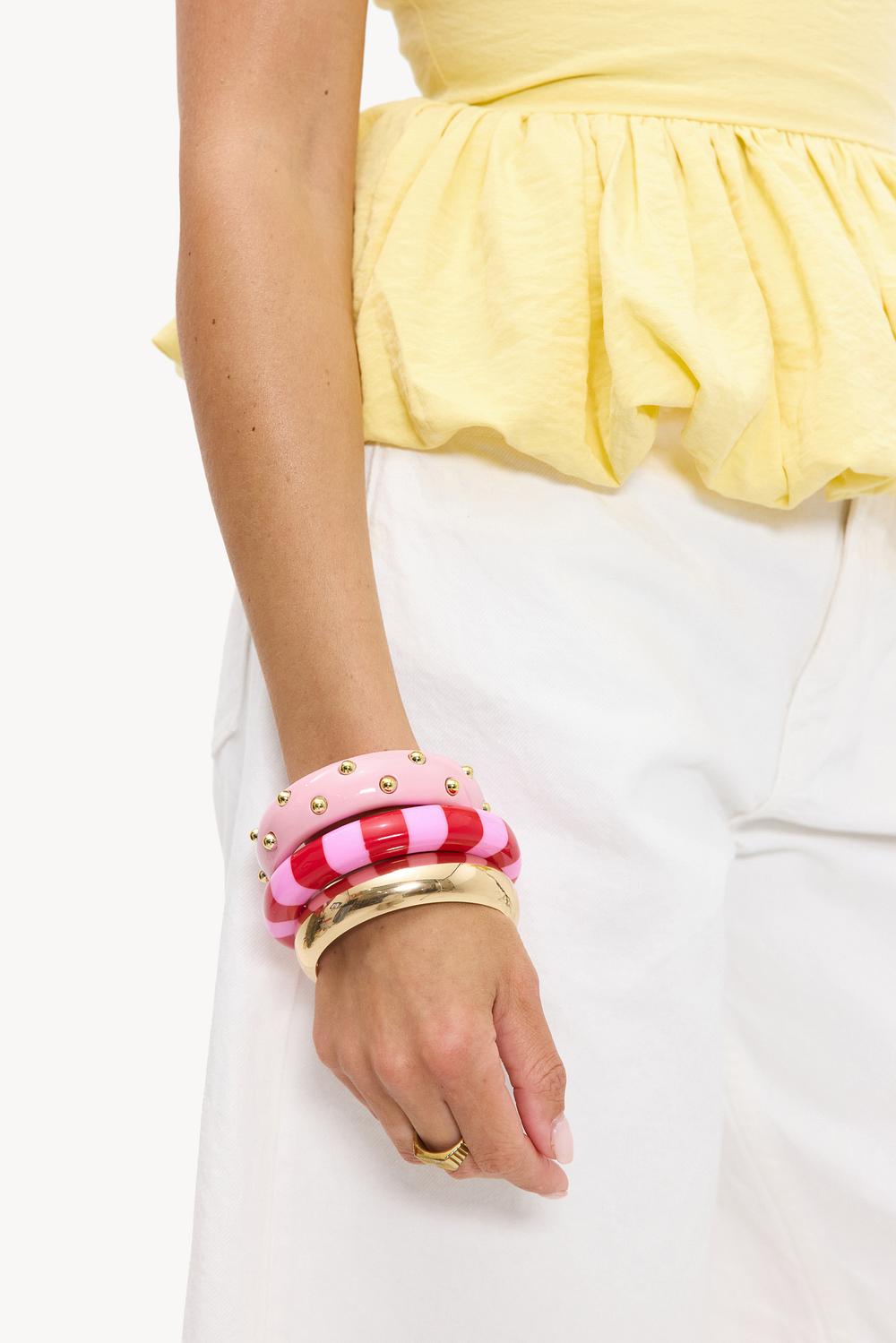 Pack de 3 pulseras rosa y doradas