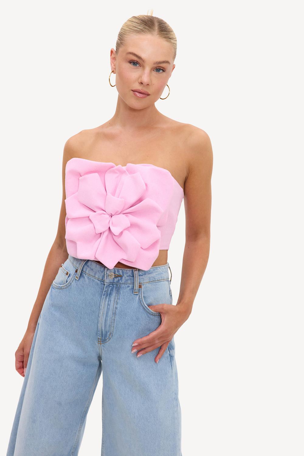 Pink bandeau top with a flower