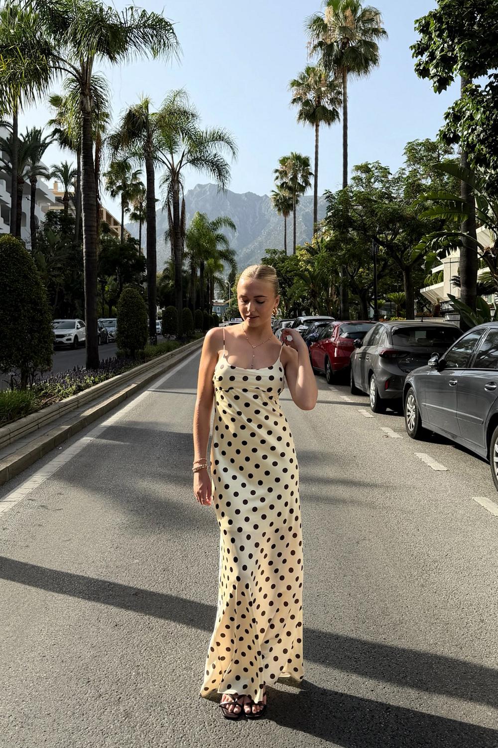 Butter-yellow satin-effect maxi dress with brown polka dots