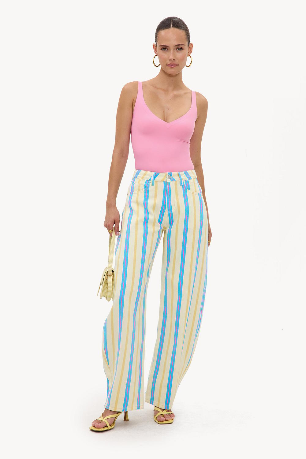 Blue balloon jeans with yellow and red stripes