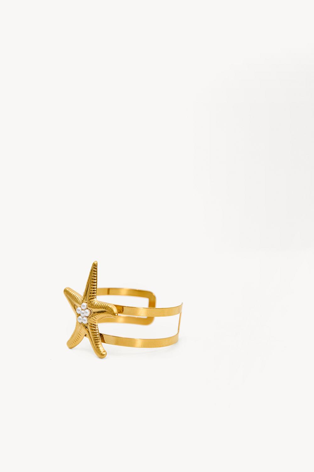 Pulsera llamativa dorada con estrella de mar
