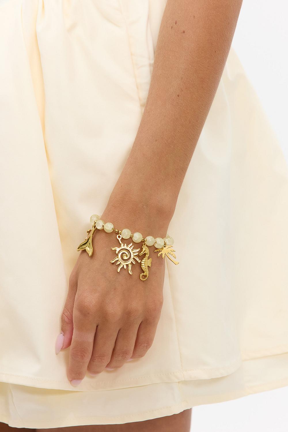 Gold beaded bracelet with charms
