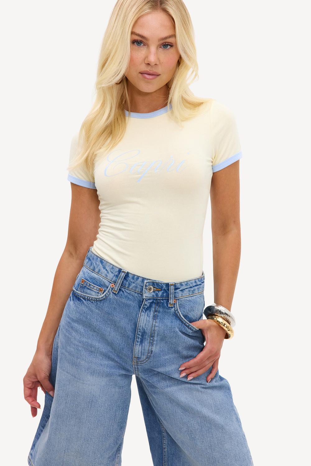Butter-yellow bodysuit with light blue details