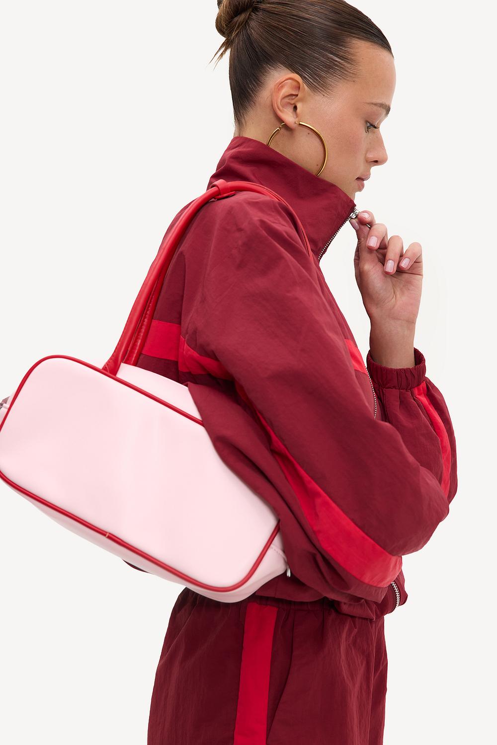 Light pink bag with red details