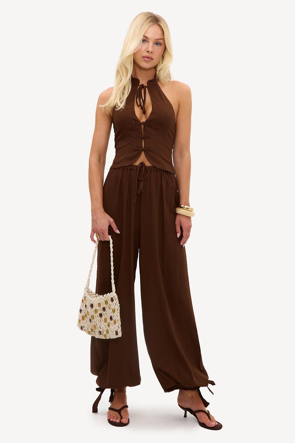 Brown trousers with bows