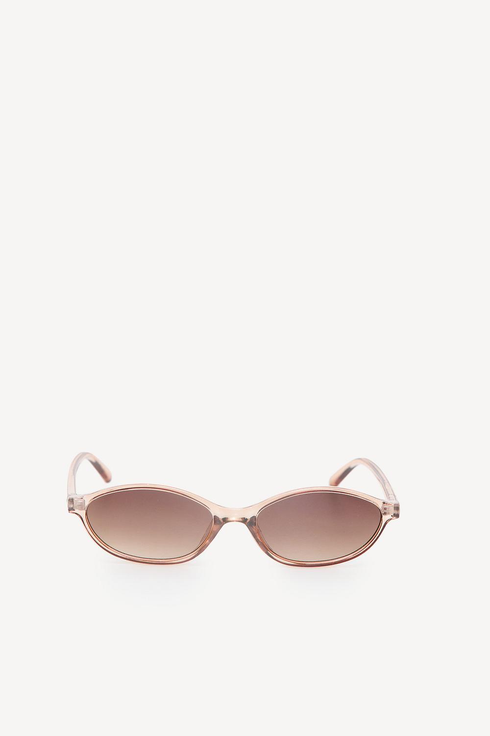 Beige sunglasses with transparent frames and brown lenses
