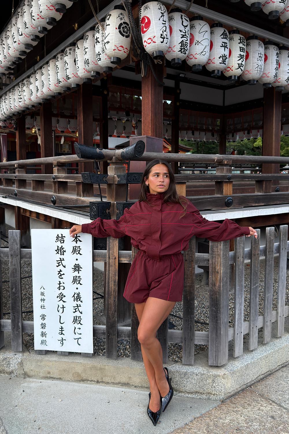 Burgundy playsuit with red stripes