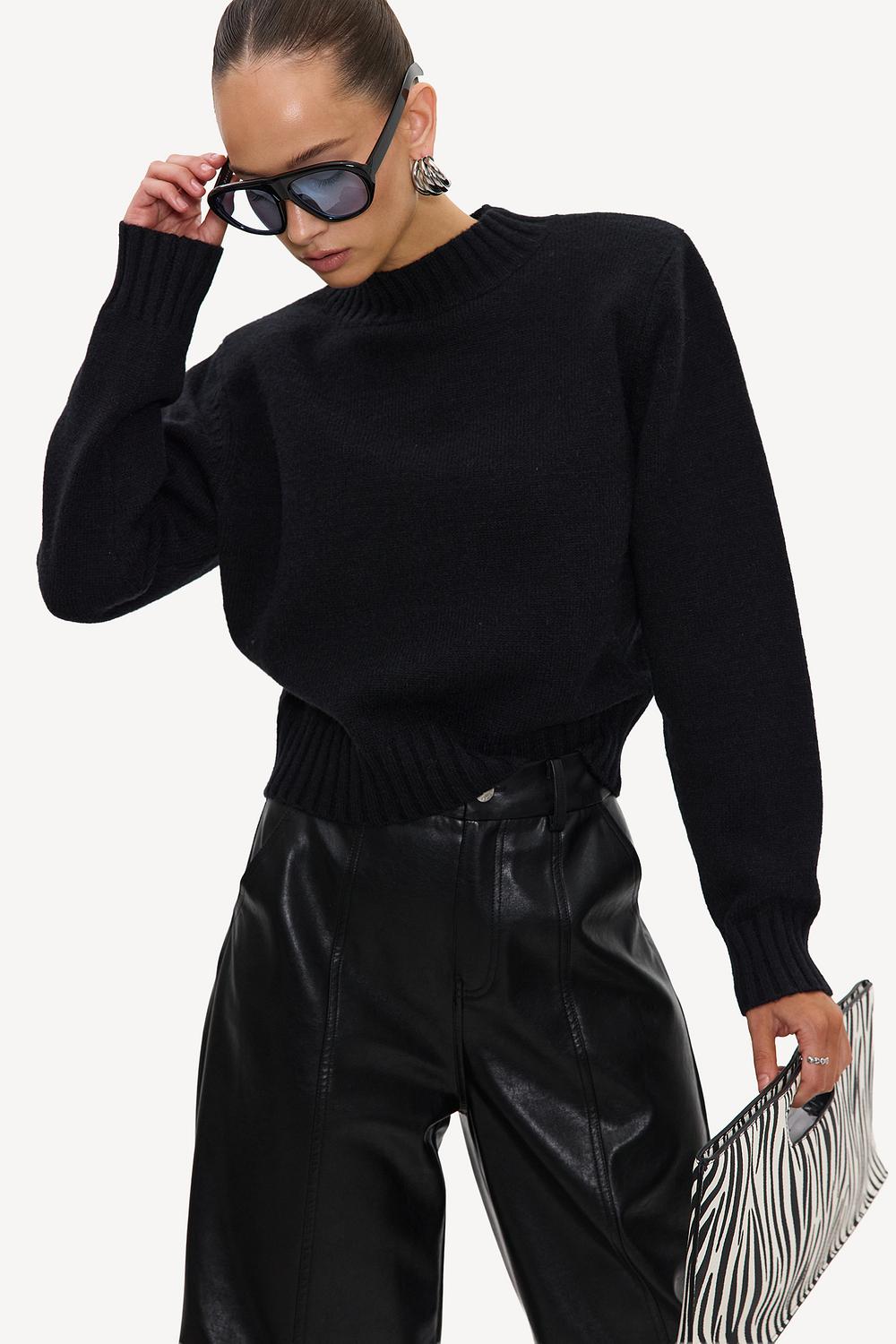 Black jumper with shoulder pads