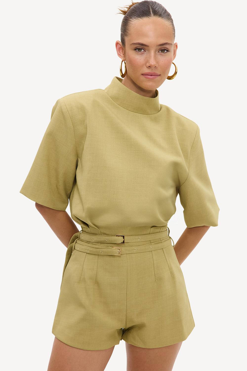 Light green playsuit with belt and shoulder pads