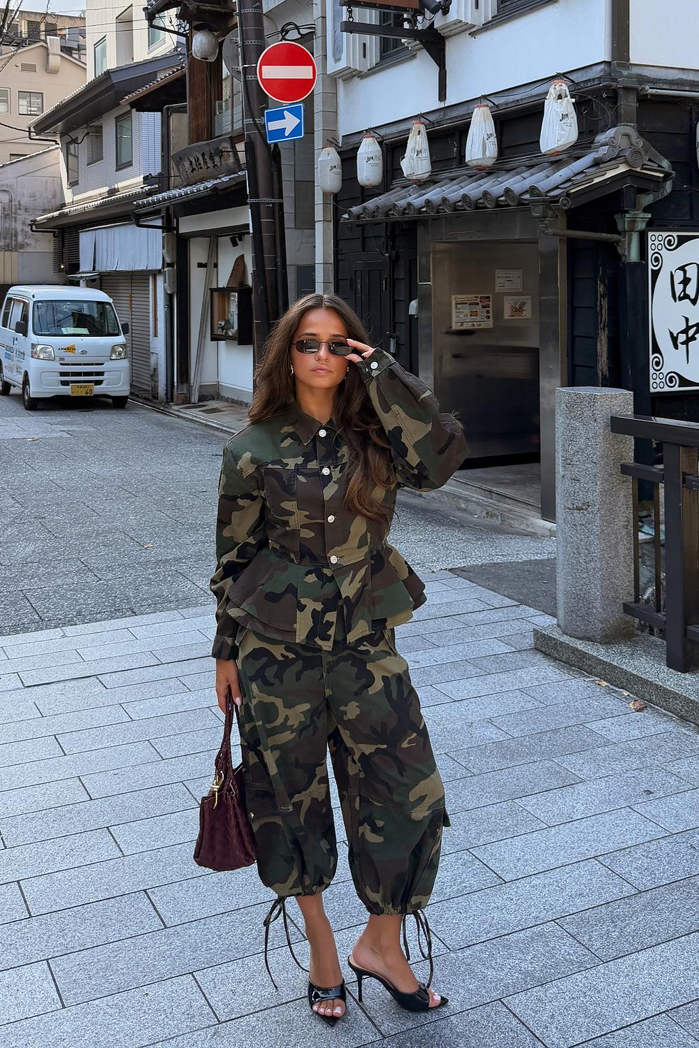 Green jacket with military print and ruffle details