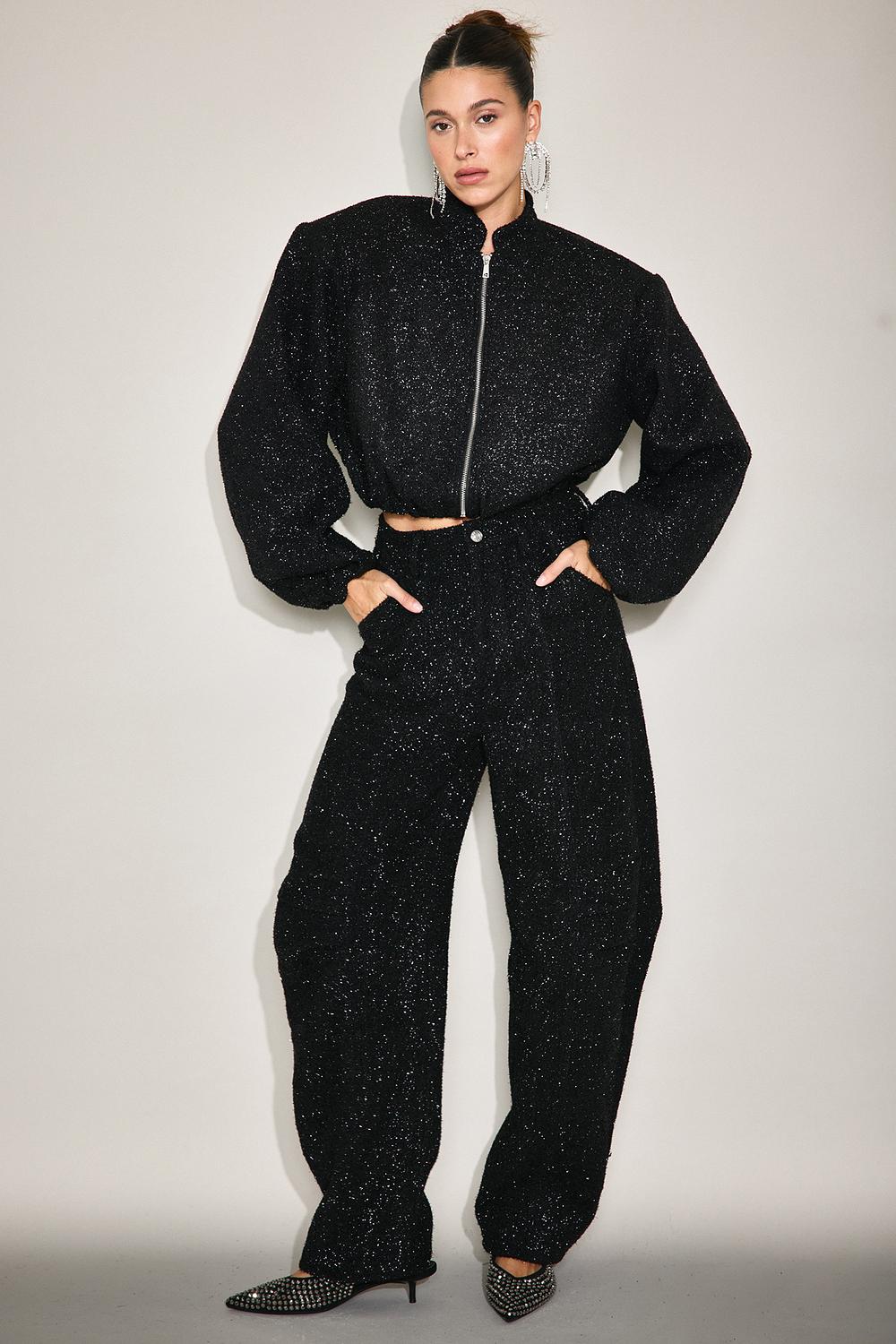 Pantalones negros de corte globo con hilo de lurex