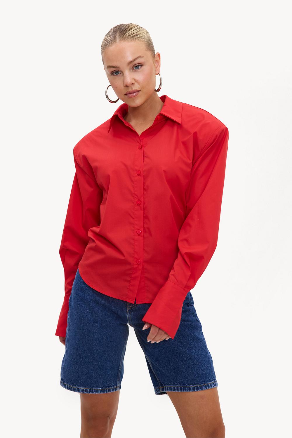Red blouse with bow belt and shoulder pads