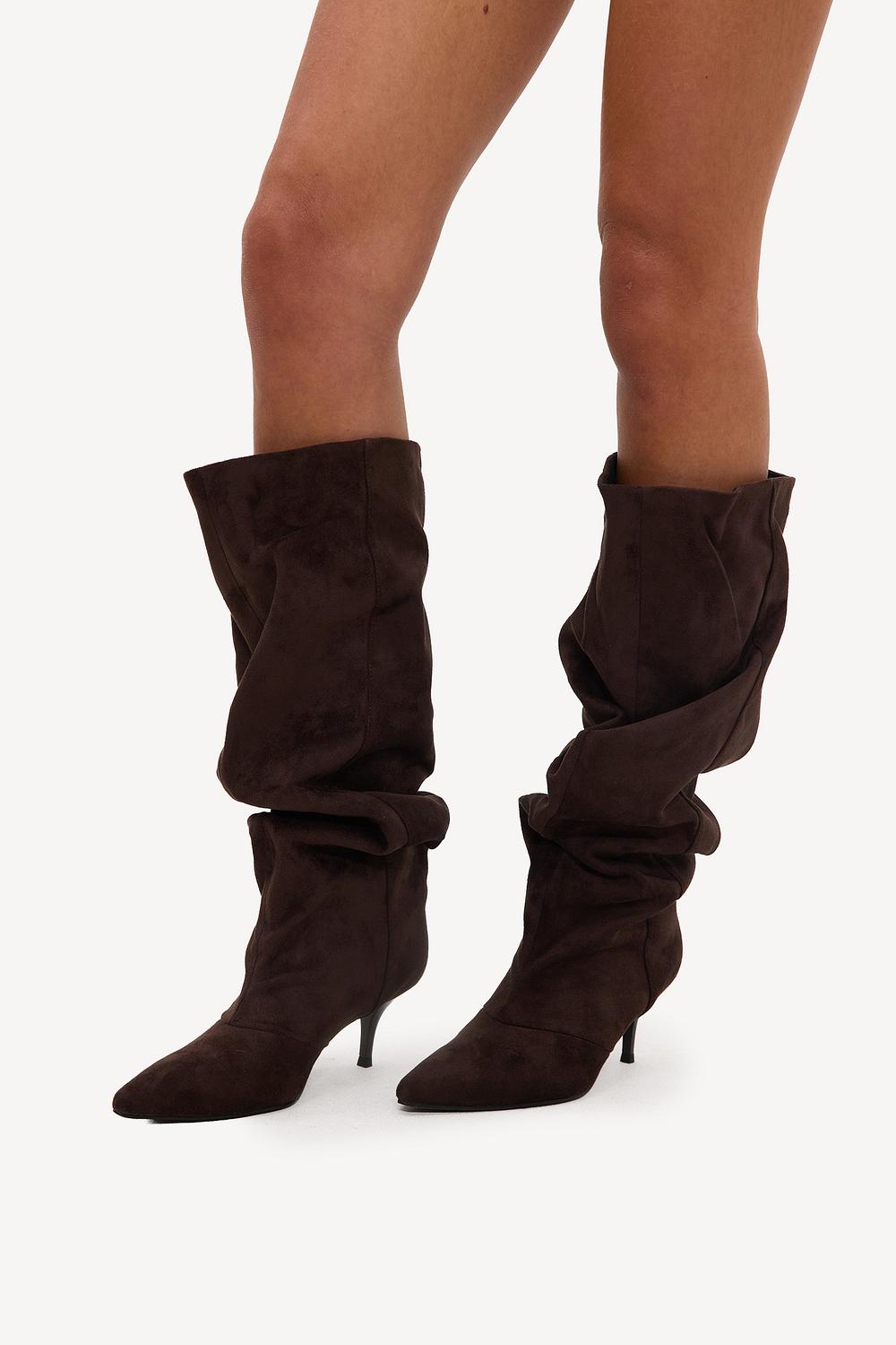 Brown high-top heeled boots with a suede-effect finish