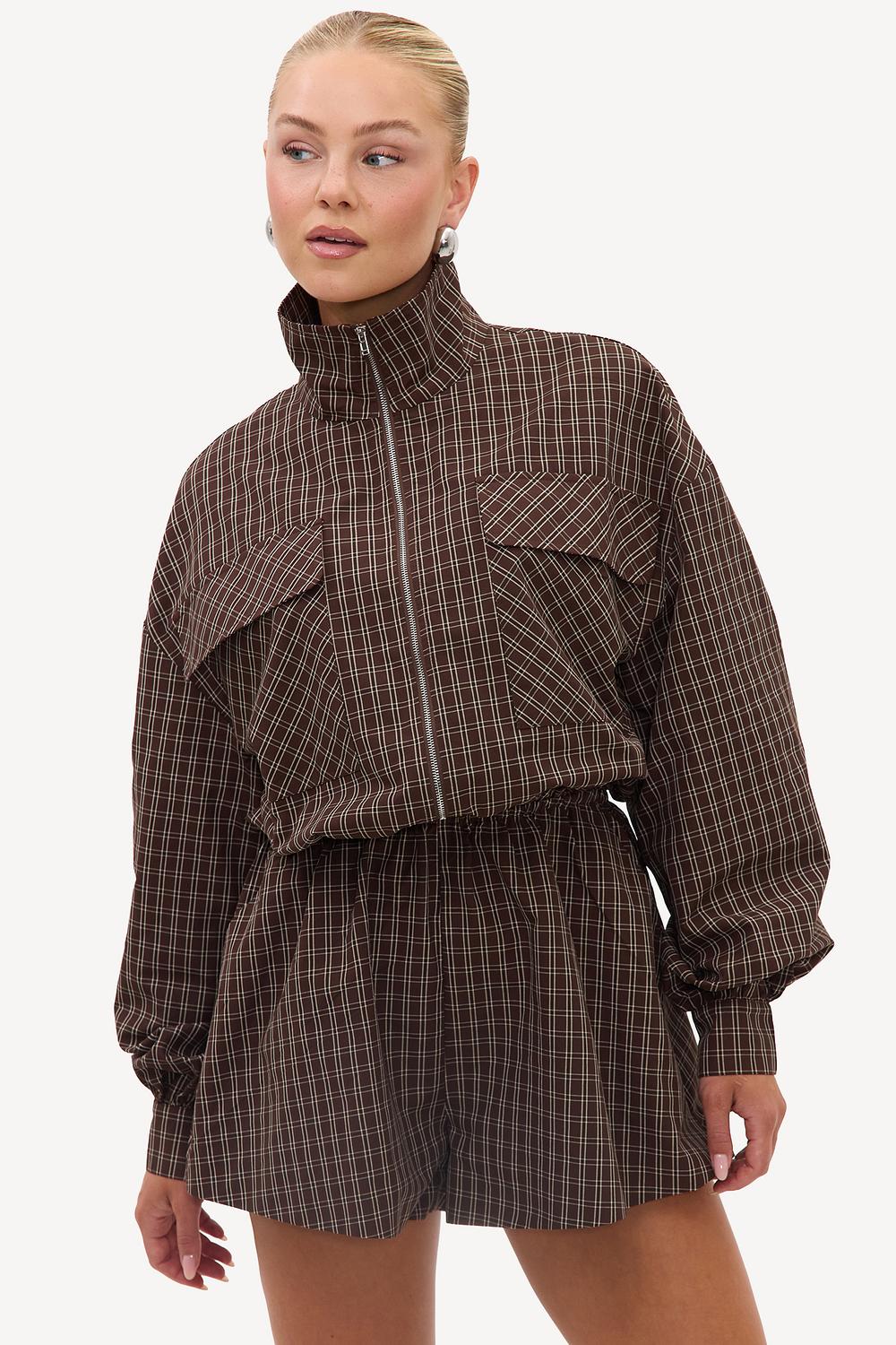 Brown checkered playsuit with long sleeves
