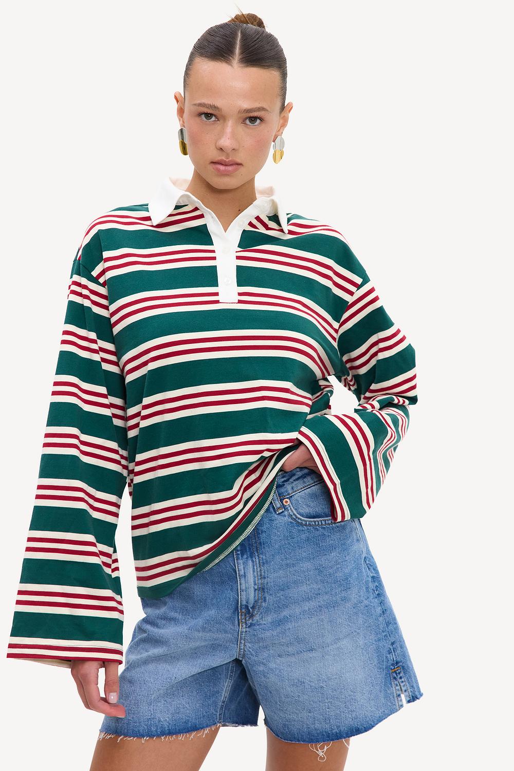 Green long-sleeved polo top with white and red stripes