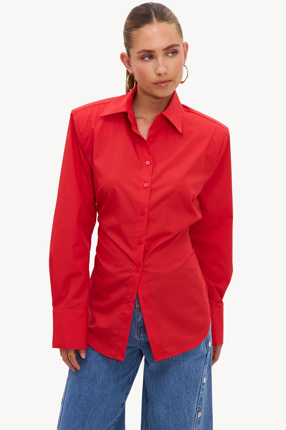 Rode blouse met schoudervulling en strikdetail