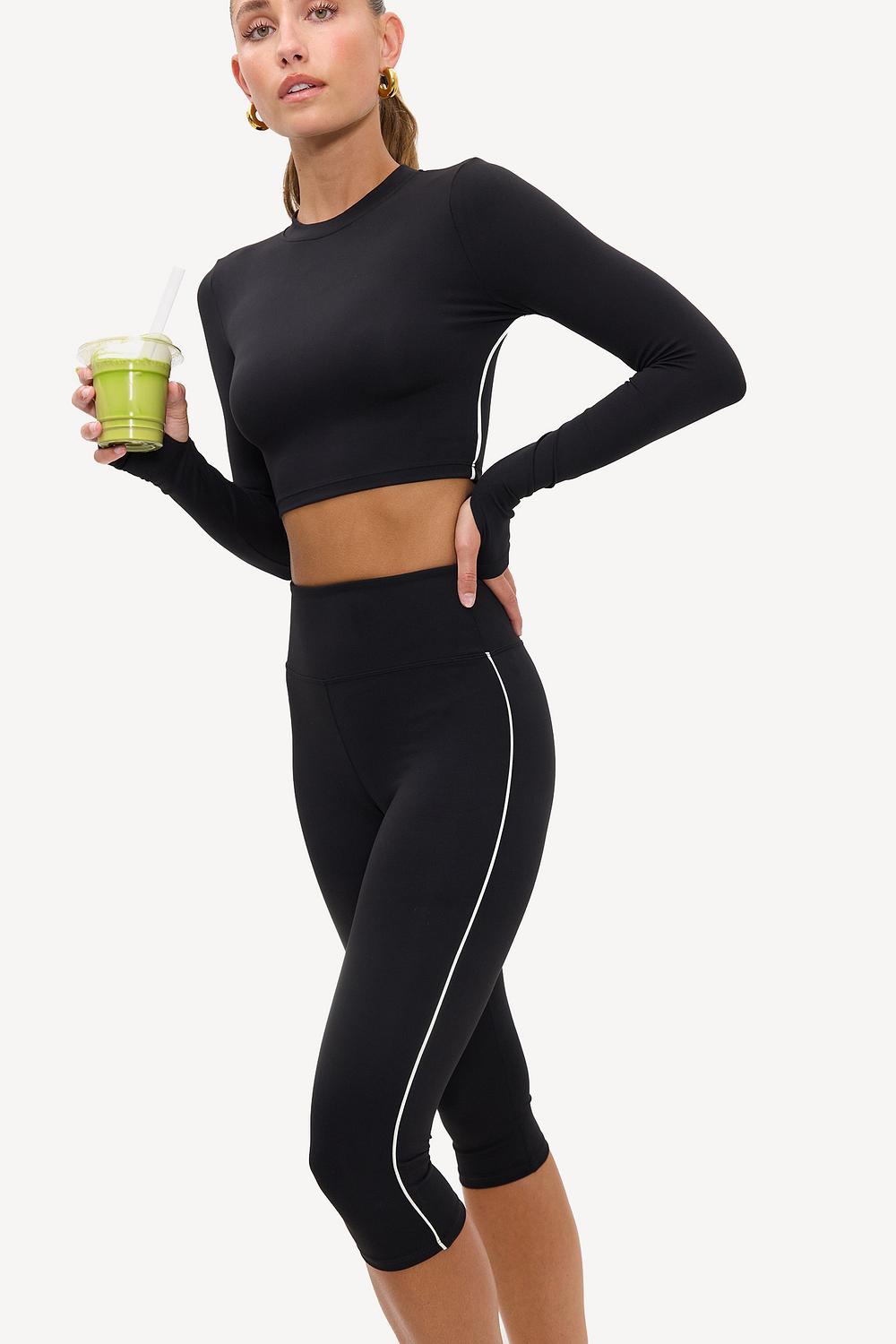 Black capri sports leggings with white details