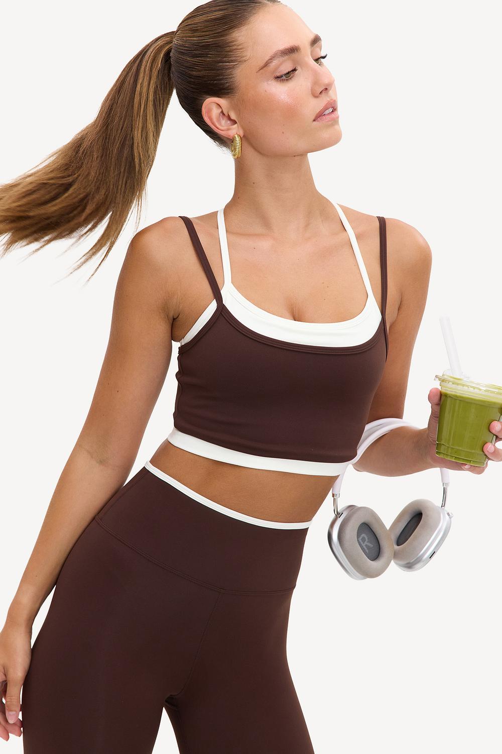 Brown sports top with a white undershirt