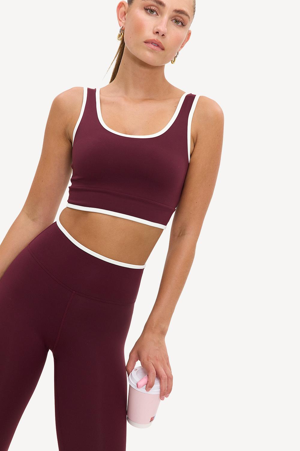 Burgundy cropped sports top with white detailing and cups